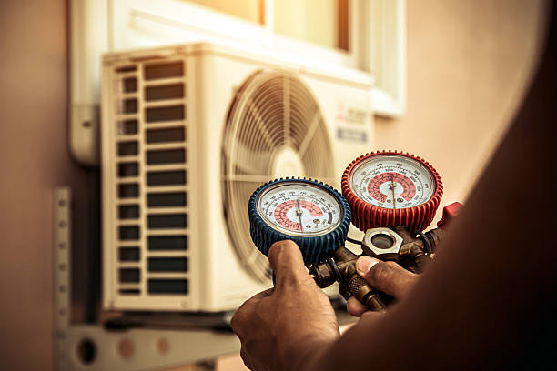 Professional Heat Pump Repair technician working in Hemet, CA